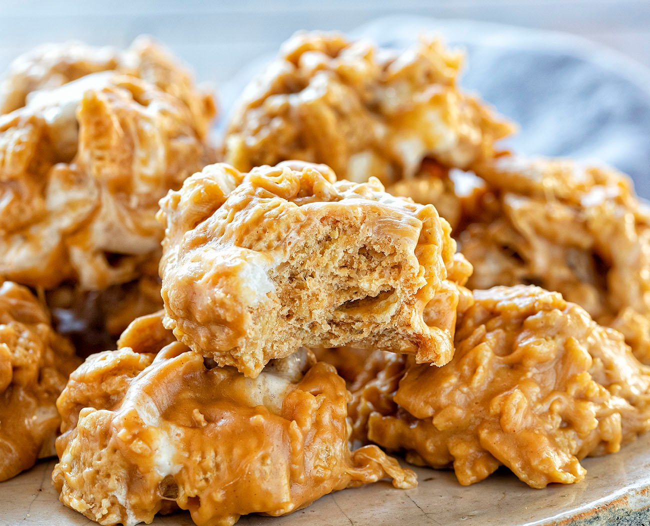 The best no-bake desserts to get your sweet tooth through the summer! no bake, no bake desserts, desserts, recipes, cheesecake, cookies, bars, cake, pudding, mousse, puppy chow, muddie buddies, rice krispy bars, dessert, memorial day dessert, labor day desserts, i am baker, iambaker No Bake Special K Cookies with One Bit Into.